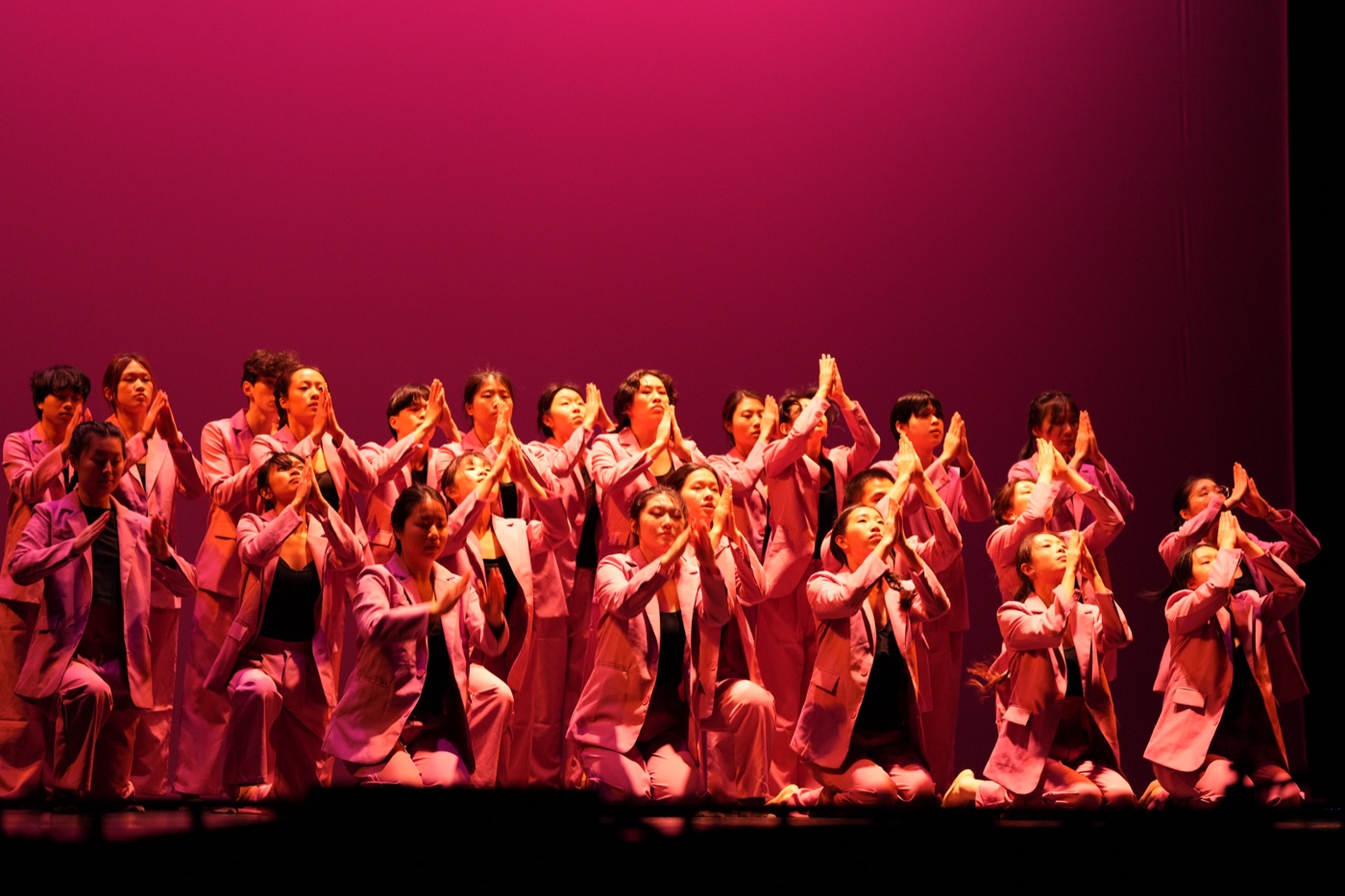 Ensemble dance performance pink suits